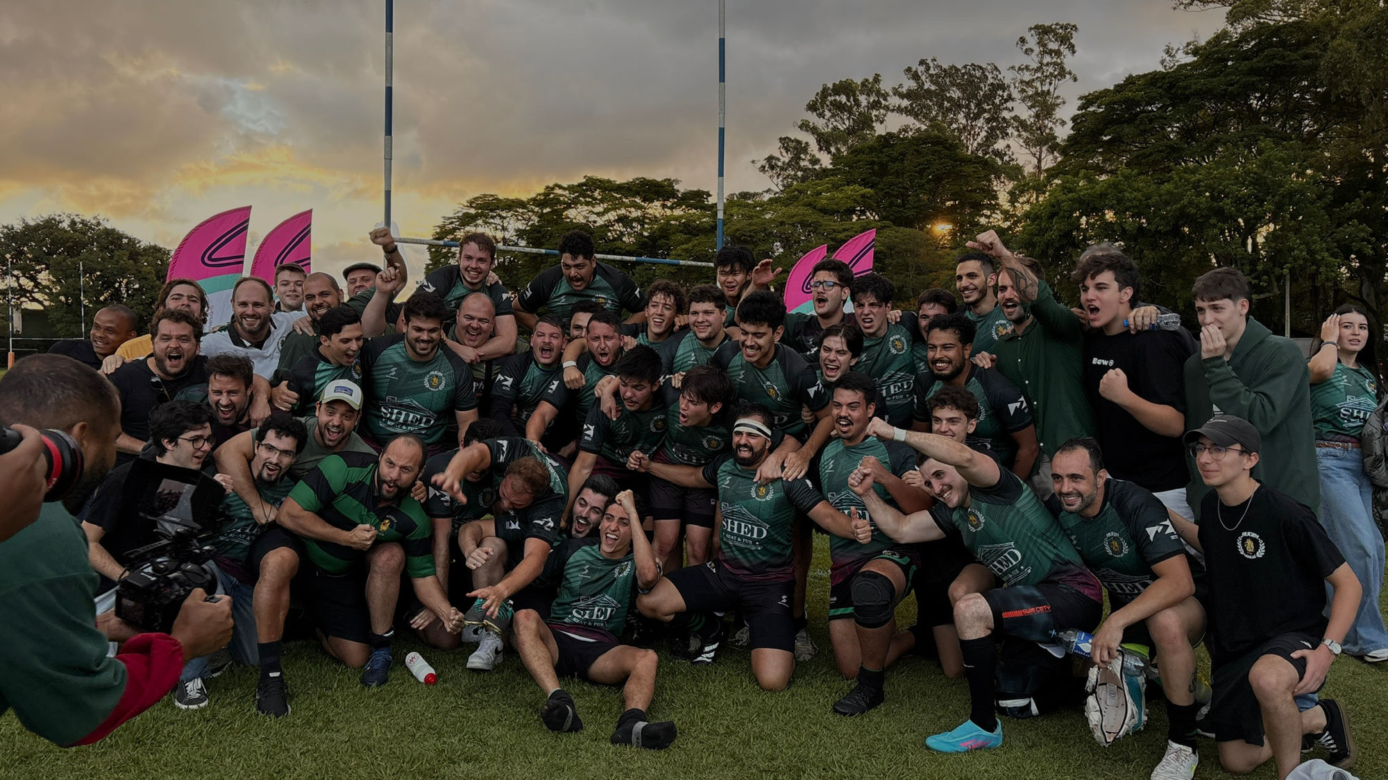 Rugby Mauá celebrating a win at sunset