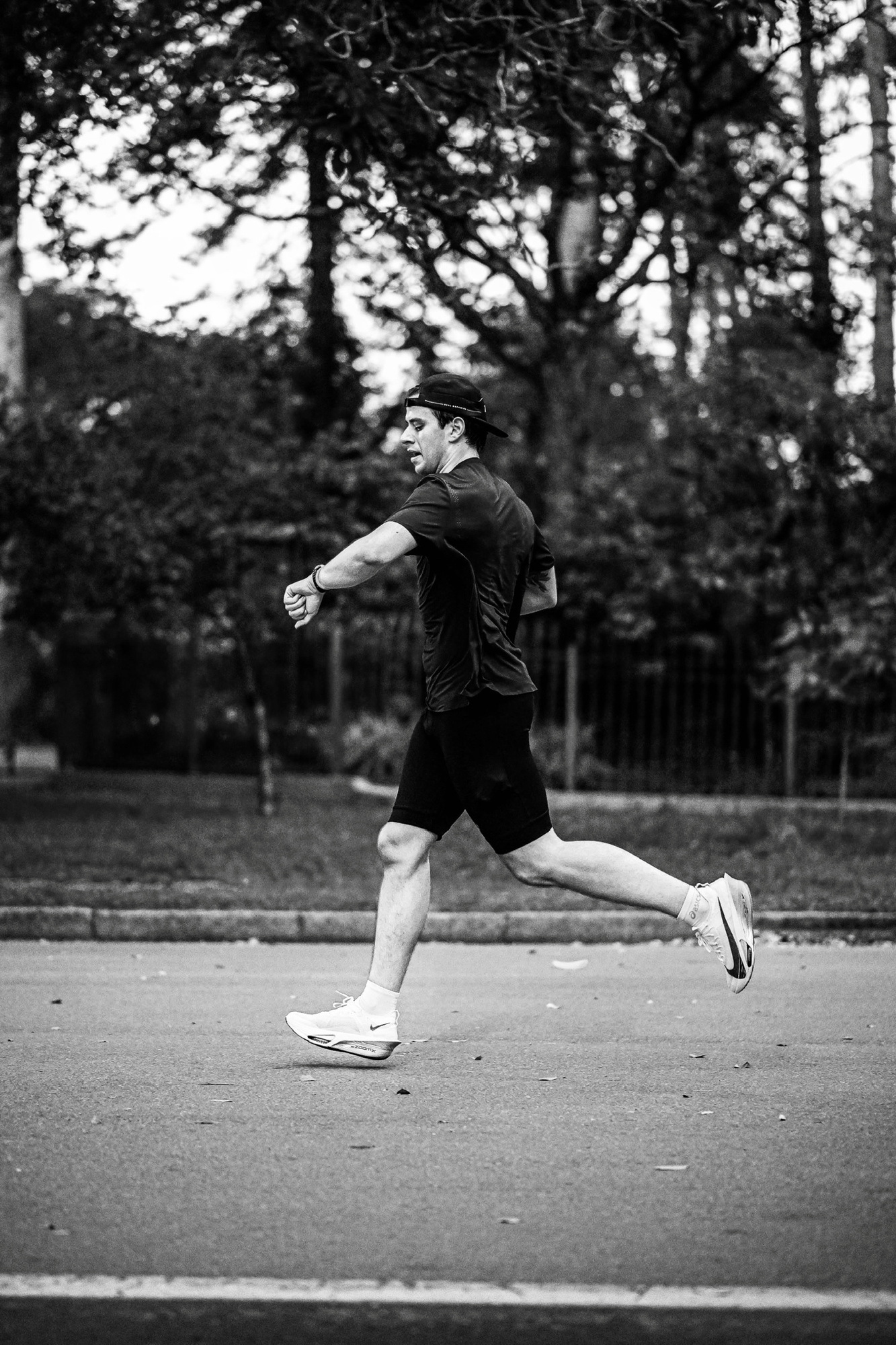 Checking the watch mid-stride in the park